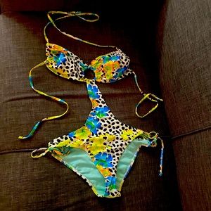 Stylish one piece suit . Never been worn